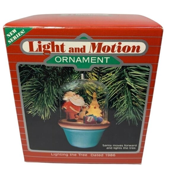 Light and Motion Hallmark Ornament- Lighting the Tree‎ Santa Lights the Tree - Picture 1 of 2